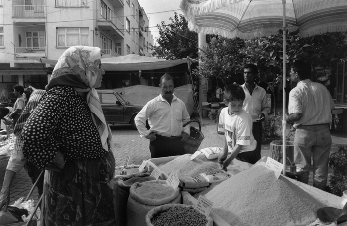 Boy selling food staples in open market, Selçuk, Turkey, 1994